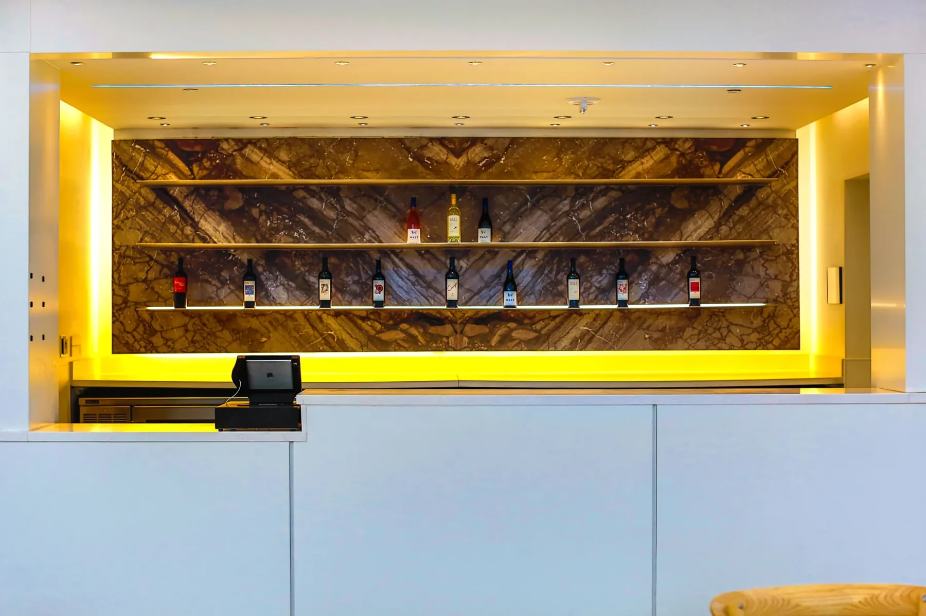 The illuminated bar on The Artisan rooftop terrace