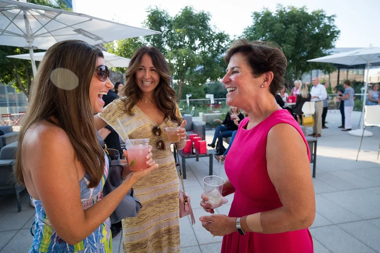Guests talking at a terrace event
