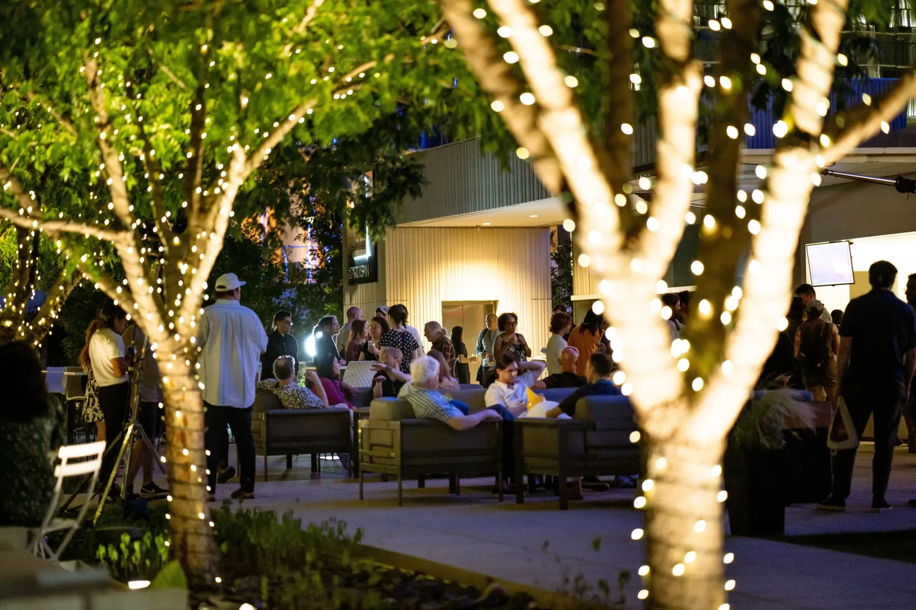 Evening dinner under string lights on The Artisan rooftop terrace