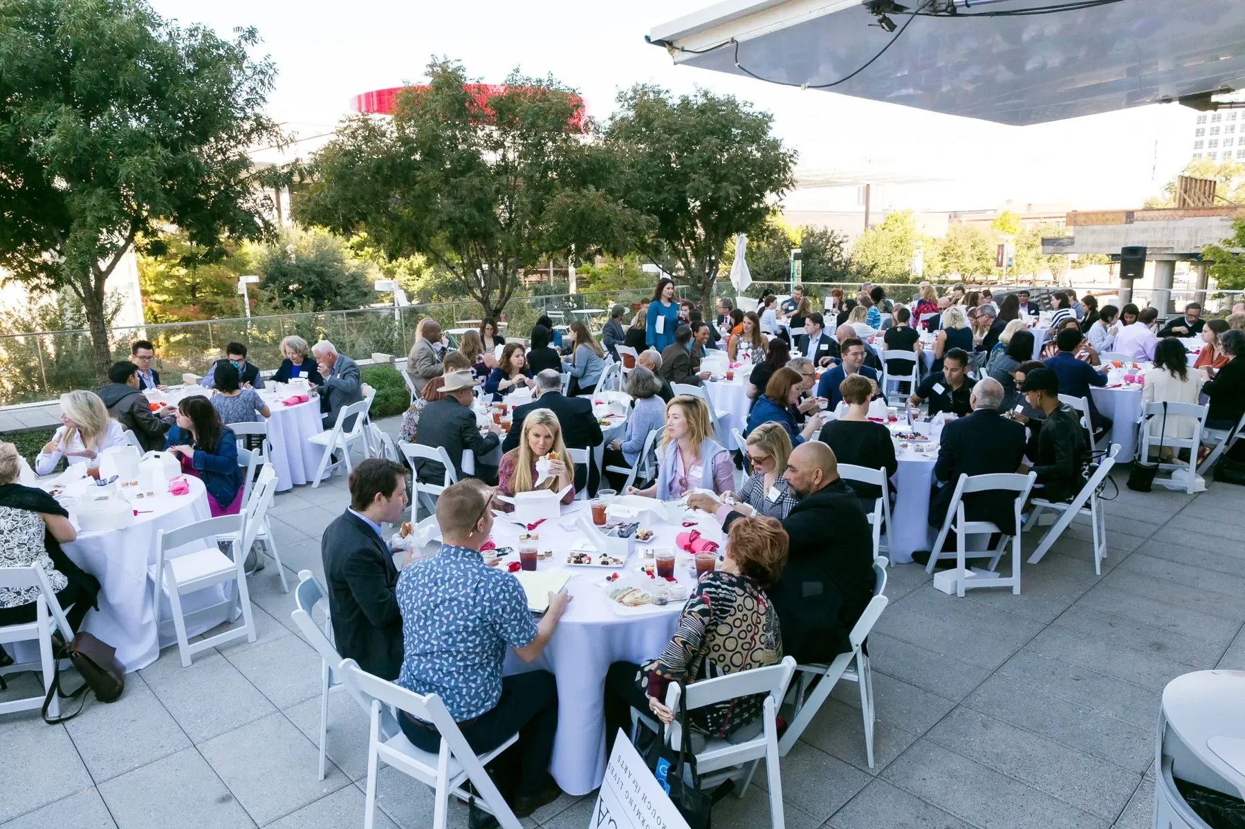 A large seated dinner on the rooftop terrace