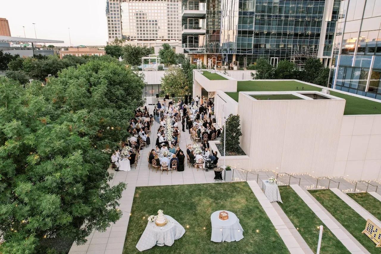 Wedding guests seated on the terrace lawn