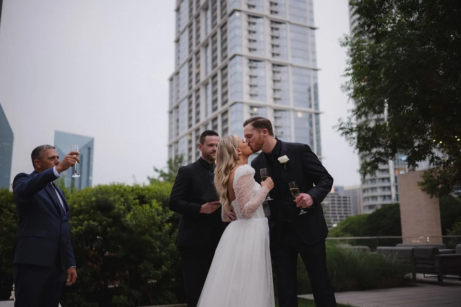 A couple with the Dallas skyline behind