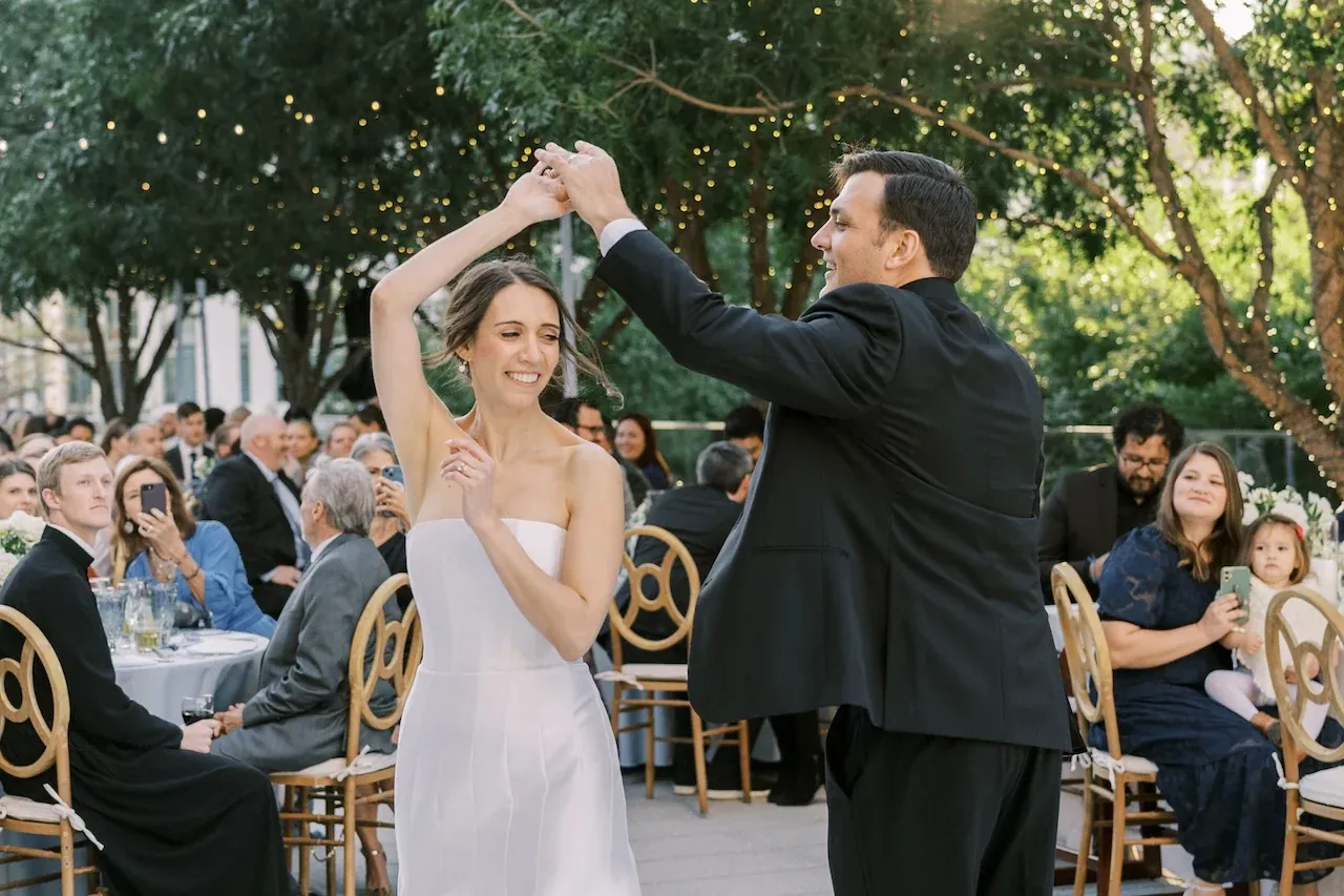 A first dance under string lights