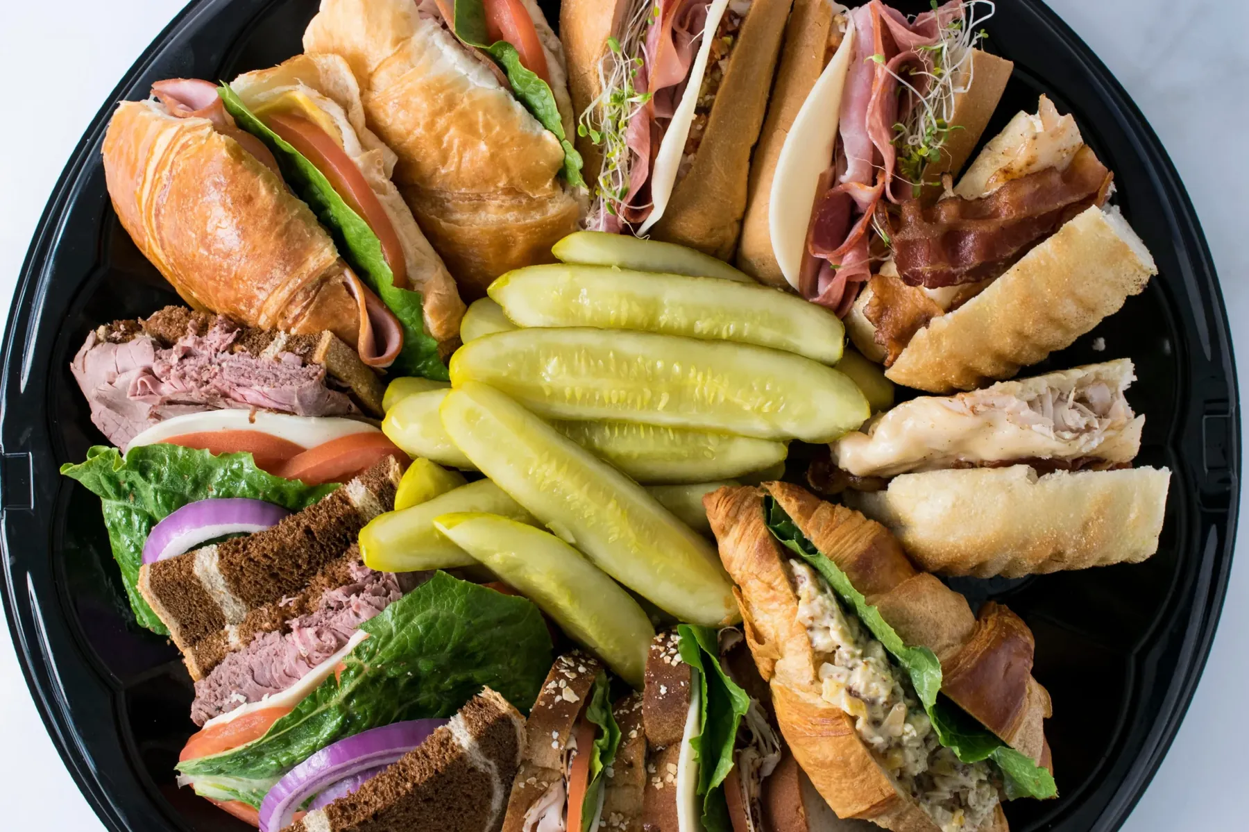 A spread of sandwiches and sides from The Artisan Craft Kitchen