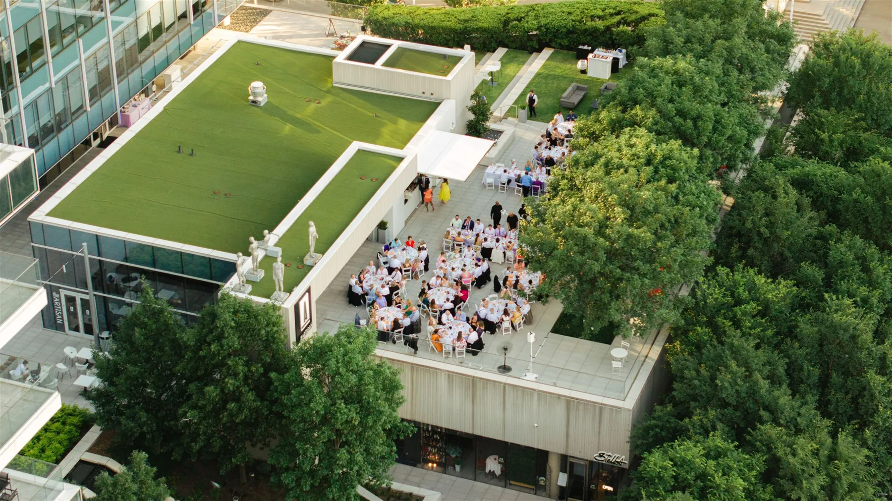An aerial view of a wedding ceremony on the terrace lawn